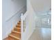 Stairway to second level, with light entering from the living room at 11304 Cayman Key Ave # 2, Tampa, FL 33624