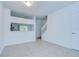 Bright living room featuring tile flooring and staircase at 11304 Cayman Key Ave # 2, Tampa, FL 33624