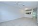 Spacious living room with tile floors and modern ceiling fan at 11304 Cayman Key Ave # 2, Tampa, FL 33624