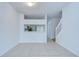 Bright living room featuring tile flooring and a view into the kitchen at 11304 Cayman Key Ave # 2, Tampa, FL 33624