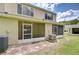 View of a screened patio with a tan exterior, and a brick paver patio, perfect for outdoor entertaining at 11304 Cayman Key Ave # 2, Tampa, FL 33624