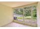 Screened patio offers a serene view of the pool area and lush greenery at 11304 Cayman Key Ave # 2, Tampa, FL 33624