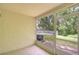 Screened-in patio showcasing a view of the community pool and surrounding landscape at 11304 Cayman Key Ave # 2, Tampa, FL 33624