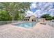 Community pool area with a diving board and lounging space surrounded by lush greenery providing a relaxing atmosphere at 11304 Cayman Key Ave # 2, Tampa, FL 33624