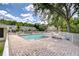 Community pool featuring brick paver deck, lounge chairs, and a backdrop of well-maintained residences at 11304 Cayman Key Ave # 2, Tampa, FL 33624