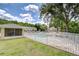 Community pool area with a view of the pool house and residences, surrounded by green space at 11304 Cayman Key Ave # 2, Tampa, FL 33624