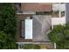 Overhead view of the home displaying the roof, surrounding yard, and the layout of the screened patio at 11416 Wellman Dr, Riverview, FL 33578