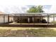 A spacious, screened-in patio extends from the home into the backyard, offering an outdoor living space at 11416 Wellman Dr, Riverview, FL 33578