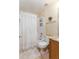 Compact bathroom featuring a shower-tub combo and neutral finishes at 11416 Wellman Dr, Riverview, FL 33578