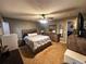 Cozy bedroom offers ample space and storage, featuring a queen-sized bed, dressers, and modern decor at 11416 Wellman Dr, Riverview, FL 33578