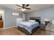 Comfortable bedroom features neutral walls, ceiling fan and double windows at 11416 Wellman Dr, Riverview, FL 33578