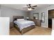 Comfortable bedroom features ceiling fan and warm-toned neutral walls at 11416 Wellman Dr, Riverview, FL 33578