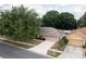 Charming single-story home with a well-manicured lawn, a paved driveway, and attached two-car garage at 11416 Wellman Dr, Riverview, FL 33578