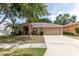 Lovely single-Gathering home featuring a driveway and well-manicured front lawn at 11416 Wellman Dr, Riverview, FL 33578
