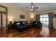 Comfortable living room features hardwood floors and sliding glass doors at 11416 Wellman Dr, Riverview, FL 33578