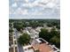 Aerial view showing a residential neighborhood with mature trees, paved streets, and well-maintained homes at 11416 Wellman Dr, Riverview, FL 33578