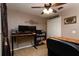 Comfortable home office setup includes dual monitors and rustic decor at 11416 Wellman Dr, Riverview, FL 33578