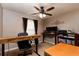 Home office featuring dual monitors, natural light, and ceiling fan at 11416 Wellman Dr, Riverview, FL 33578
