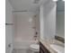 A bathroom featuring a shower-tub combination and a granite countertop at 12055 Cardinal Flower Dr, Riverview, FL 33579