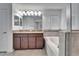 A large bathroom with double sinks, granite counters, a tub, and shower at 12055 Cardinal Flower Dr, Riverview, FL 33579