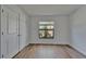 Bedroom with a window, closet, and wood-look flooring at 12055 Cardinal Flower Dr, Riverview, FL 33579