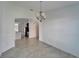 Bright dining room shows tile flooring and an elegant chandelier at 12055 Cardinal Flower Dr, Riverview, FL 33579