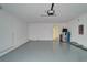 Large garage with epoxy floors and a water heater at 12055 Cardinal Flower Dr, Riverview, FL 33579