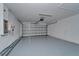 A garage featuring epoxy floors and a modern overhead door at 12055 Cardinal Flower Dr, Riverview, FL 33579
