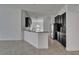 Kitchen with granite countertops, breakfast bar, dark cabinets, and stainless steel appliances, offering modern convenience at 12055 Cardinal Flower Dr, Riverview, FL 33579