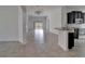 Spacious living room features tile flooring, arched doorways, and sliding glass doors to the backyard at 12055 Cardinal Flower Dr, Riverview, FL 33579