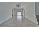 Open concept living room featuring tile floors, arched doorways and backyard access at 12055 Cardinal Flower Dr, Riverview, FL 33579