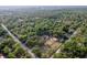 Breathtaking aerial perspective of a luxurious property, complete with a sparkling pool, expansive land, and a home at 12311 Oakwood Dr, Hudson, FL 34669