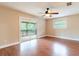 Sunlit bedroom with sliding doors to a screened lanai, enhancing indoor-outdoor living at 12311 Oakwood Dr, Hudson, FL 34669