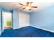 A cozy bedroom featuring closet space and doorway at 12311 Oakwood Dr, Hudson, FL 34669