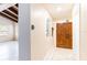 Inviting entryway with tile flooring and detailed, solid wood double doors for added curb appeal at 12311 Oakwood Dr, Hudson, FL 34669