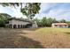 Exterior view of the home and yard at 12311 Oakwood Dr, Hudson, FL 34669