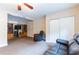 Cozy carpeted living room with large entertainment center and comfortable seating at 12311 Oakwood Dr, Hudson, FL 34669