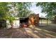 Practical outbuilding featuring covered storage for equipment, set in a spacious yard at 12311 Oakwood Dr, Hudson, FL 34669