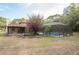 Private screened-in pool surrounded by lush greenery, perfect for relaxation and recreation at 12311 Oakwood Dr, Hudson, FL 34669