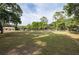 Spacious lot showcasing a barn with ample space, perfect for outdoor activities or storage at 12311 Oakwood Dr, Hudson, FL 34669