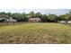 Picturesque horse property with lush pasture and a well-maintained shed or barn for animal care at 12311 Oakwood Dr, Hudson, FL 34669
