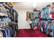 A walk-in closet featuring custom shelving and ample storage for clothes and accessories at 12311 Oakwood Dr, Hudson, FL 34669