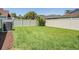 Spacious backyard with lush greenery, perfect for outdoor entertaining, play, and relaxation in a private setting at 12421 Seabrook Dr, Tampa, FL 33626