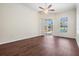 Spacious bedroom with wood floors and view to pool area through sliding glass doors at 12421 Seabrook Dr, Tampa, FL 33626