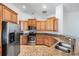 Spacious kitchen boasting stainless steel appliances, granite counters, and ample cabinet space at 12421 Seabrook Dr, Tampa, FL 33626