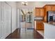 Bright kitchen with wood cabinets and stainless steel appliances, opens to screened lanai at 12421 Seabrook Dr, Tampa, FL 33626