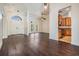 Spacious living area featuring a soaring ceiling, elegant lighting, and a seamless connection to the kitchen at 12421 Seabrook Dr, Tampa, FL 33626