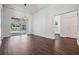 Bright, open living room with dark hardwood flooring, a sliding glass door and access to the pool at 12421 Seabrook Dr, Tampa, FL 33626