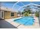 Enjoy a private backyard oasis with a screened pool and spa, perfect for relaxation and entertaining guests year-round at 12421 Seabrook Dr, Tampa, FL 33626