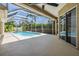 Enjoy outdoor living with this screened in pool and patio area surrounded by lush landscaping, offering privacy and relaxation at 12421 Seabrook Dr, Tampa, FL 33626